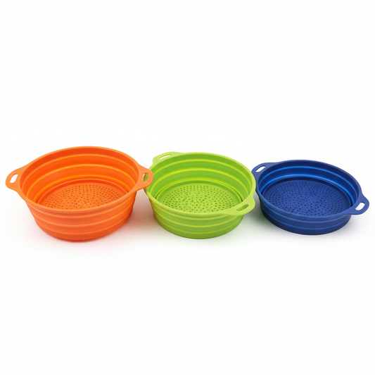 Colorful collapsible silicone colander and strainer folded flat for compact storage